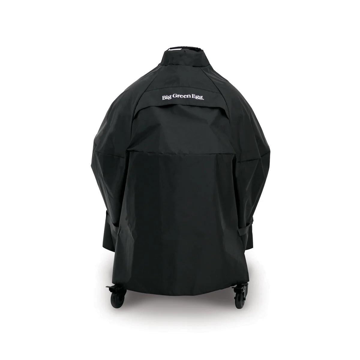 Schwarze wetterfeste Big Green Egg Abdeckhaube für das Nest 2XL über dem Keramikgrill mit Rollen.