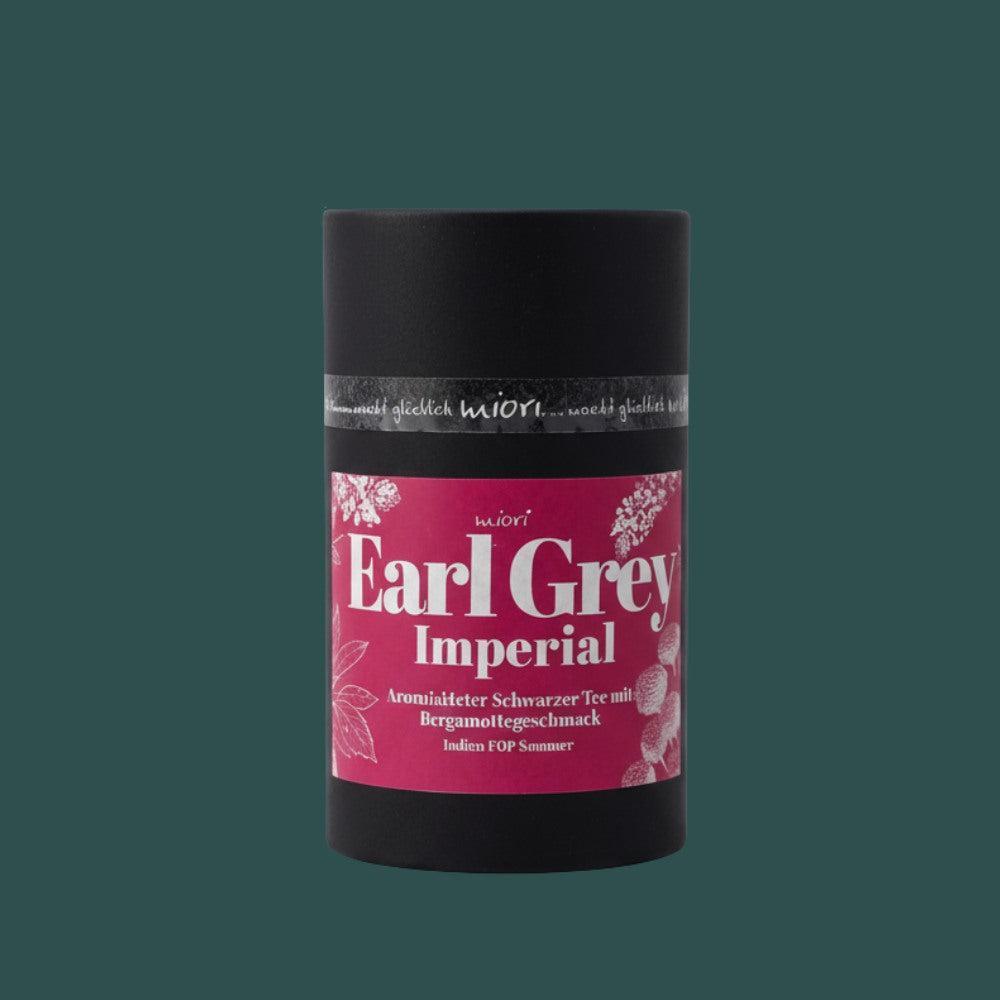 Earl Grey Imperial Teedose frontal vor dunkelgrünem Hintergrund, schwarze Röhre mit pinkem Etikett